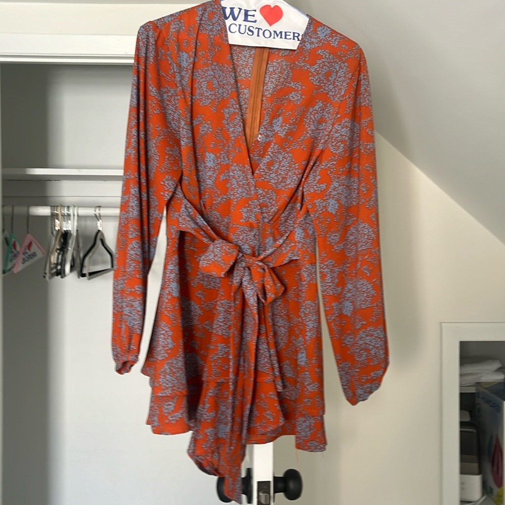 Orange and blue floral long sleeve romper